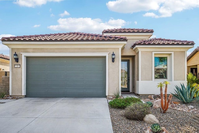 mediterranean / spanish home featuring a garage