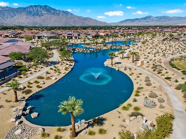 aerial view featuring a water and mountain view