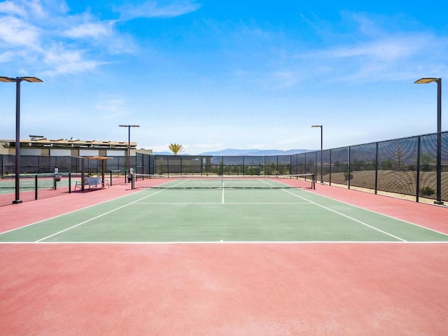 view of sport court featuring basketball court and a mountain view