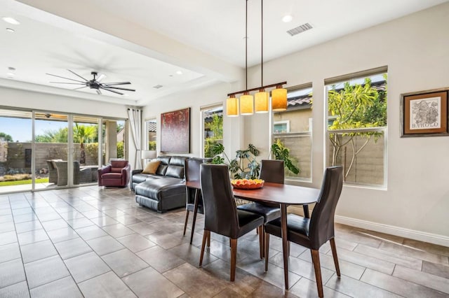 dining room featuring ceiling fan and plenty of natural light