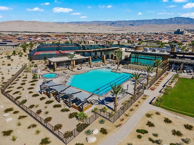 view of swimming pool with a mountain view and a patio area