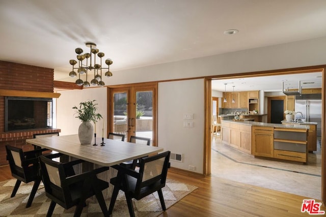 dining room featuring light hardwood / wood-style floors and sink