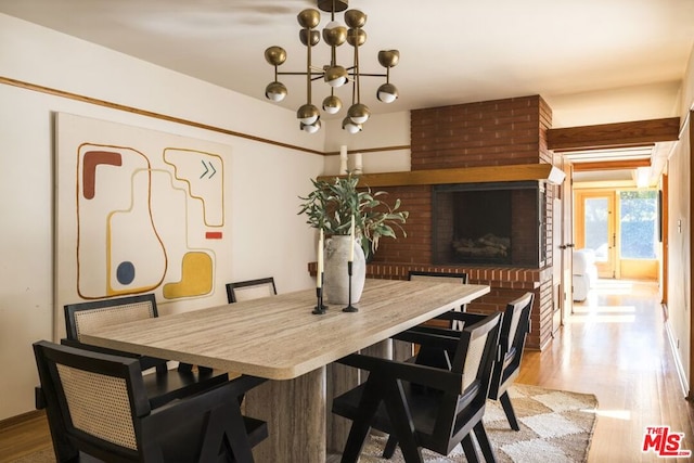 dining room featuring an inviting chandelier and light wood-type flooring