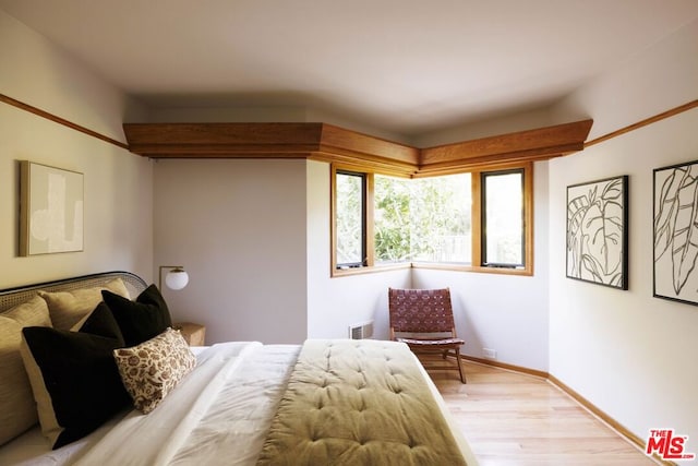 bedroom with light hardwood / wood-style floors