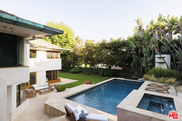 view of pool with a lawn, a patio, an outdoor living space, and an in ground hot tub