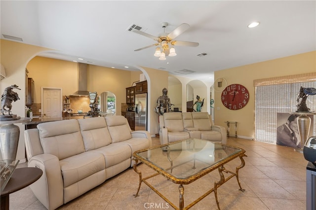 living room featuring ceiling fan and light tile patterned floors