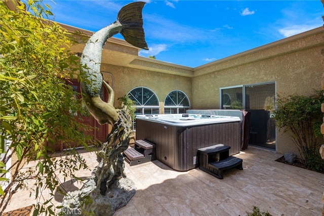 view of patio featuring a hot tub