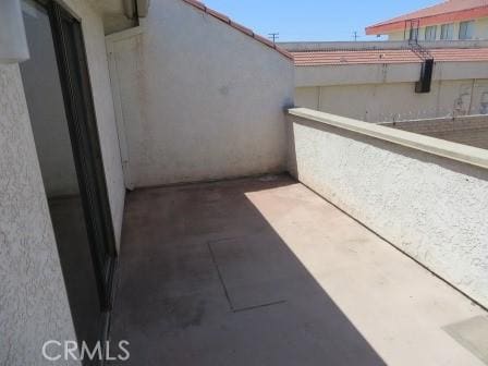 view of patio featuring a balcony