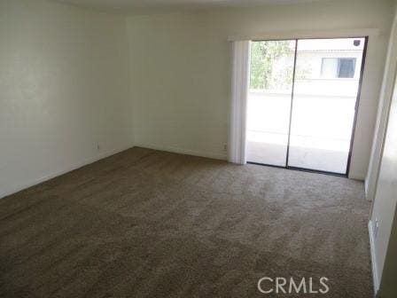 empty room with dark carpet