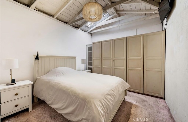 bedroom with light carpet, lofted ceiling with beams, and wood ceiling