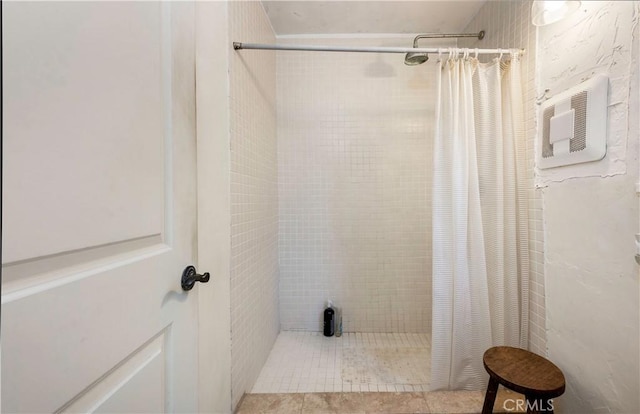 bathroom with a shower with curtain and tile patterned floors