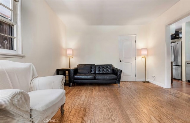 sitting room featuring light wood-type flooring