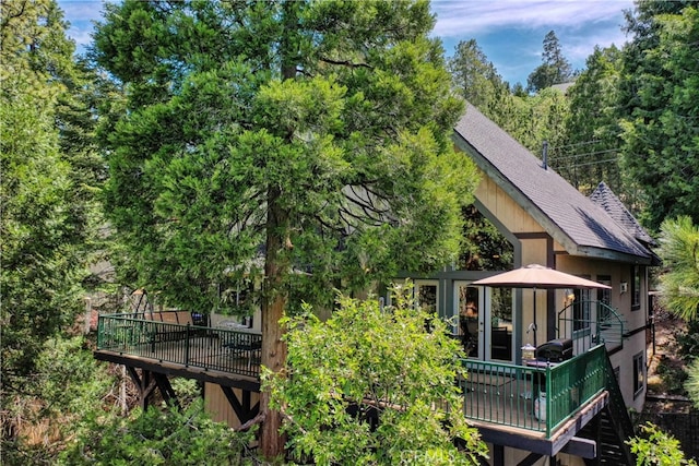 back of house featuring a wooden deck and a gazebo