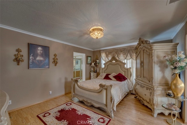 bedroom with ornamental molding and light hardwood / wood-style floors