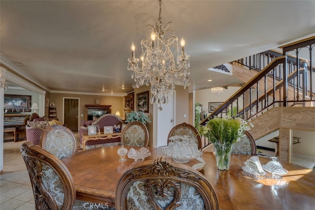 dining area featuring light tile patterned floors, ornamental molding, and a chandelier