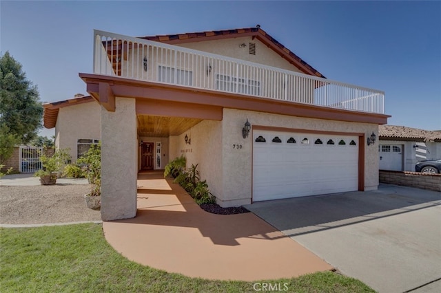 view of front of house with a balcony and a garage