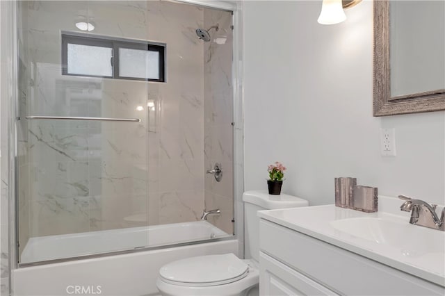 full bathroom featuring vanity, toilet, and combined bath / shower with glass door