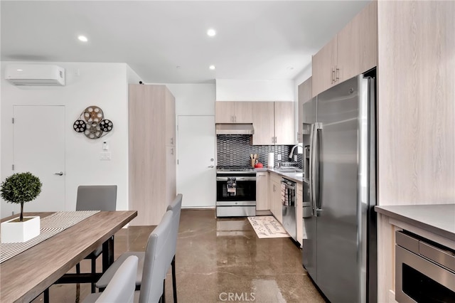 kitchen with appliances with stainless steel finishes, sink, backsplash, a wall mounted AC, and light brown cabinets