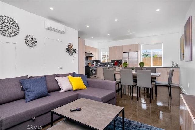 living room featuring an AC wall unit