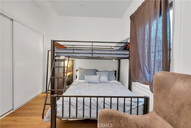 bedroom featuring a closet and hardwood / wood-style floors