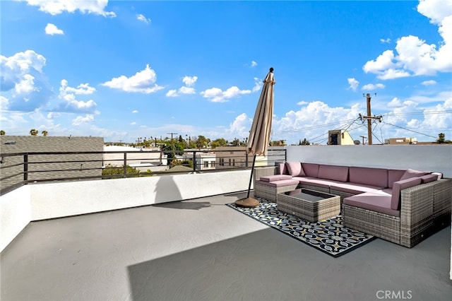 view of patio featuring a balcony and outdoor lounge area