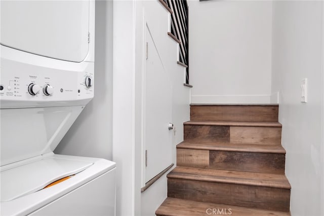 laundry room with stacked washer and dryer