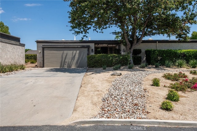 ranch-style home featuring a garage