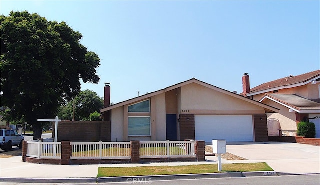 view of front of home with a garage