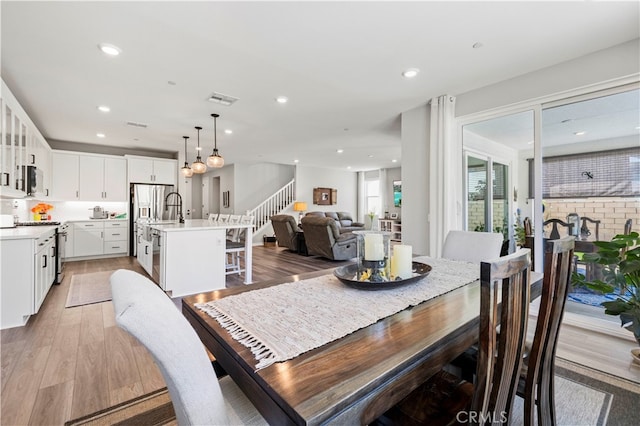 dining room with light hardwood / wood-style flooring