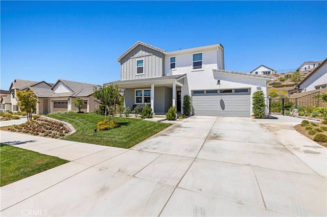 view of front facade featuring a garage and a front lawn