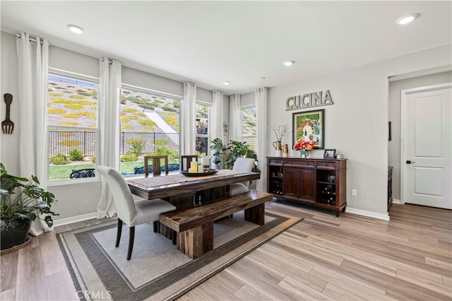 dining area with light hardwood / wood-style floors