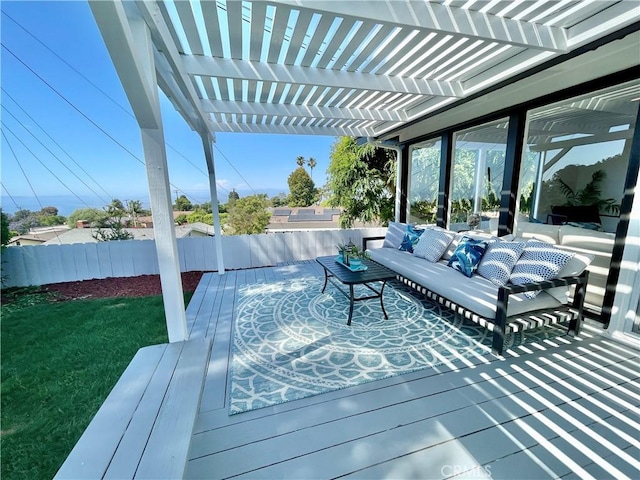 deck featuring an outdoor living space and a pergola