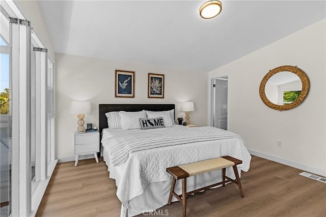 bedroom with wood-type flooring