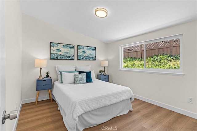 bedroom with hardwood / wood-style flooring