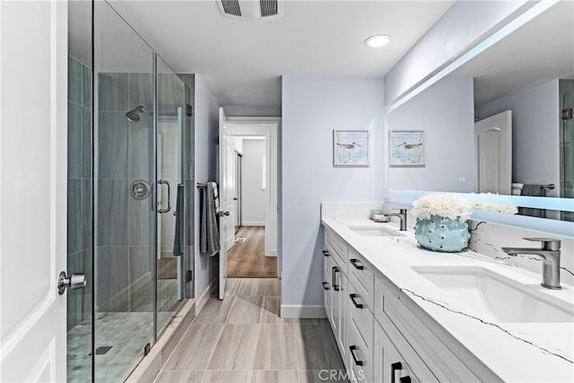 bathroom with vanity and walk in shower