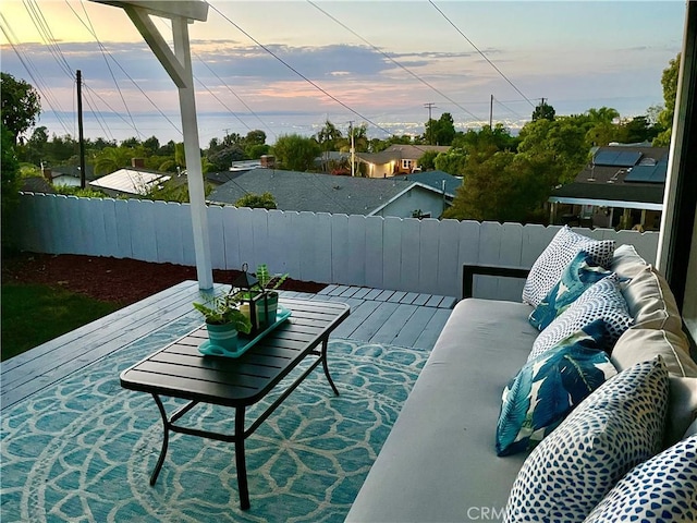 patio terrace at dusk featuring a deck