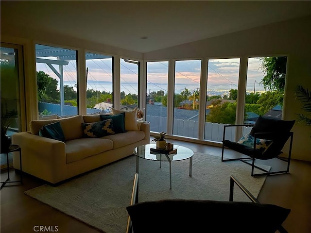 sunroom / solarium with a wealth of natural light and lofted ceiling