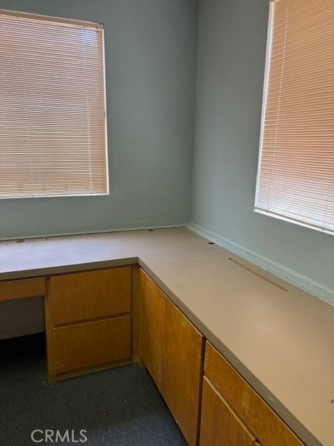 unfurnished office with built in desk