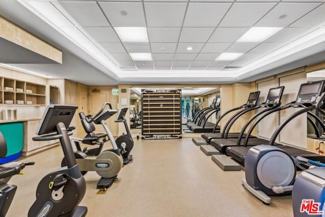 workout area featuring a drop ceiling