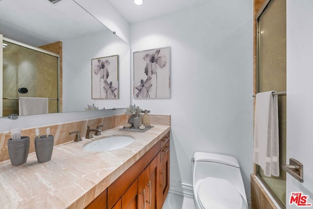 bathroom featuring toilet and vanity