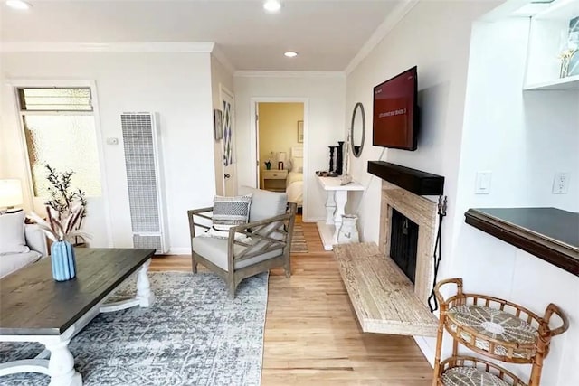 interior space with light hardwood / wood-style flooring and ornamental molding