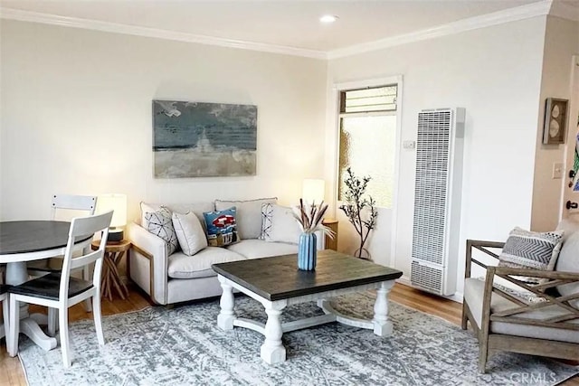 living room featuring crown molding and hardwood / wood-style flooring