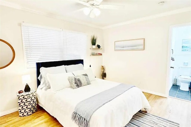 bedroom featuring ensuite bath, ceiling fan, ornamental molding, and hardwood / wood-style floors