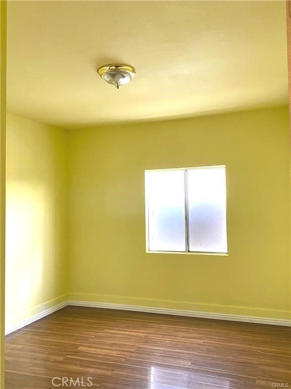 spare room featuring hardwood / wood-style flooring