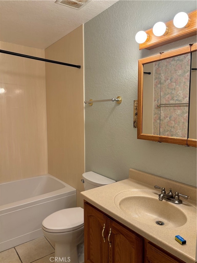 full bathroom with toilet, tile patterned flooring, a textured ceiling, tub / shower combination, and vanity