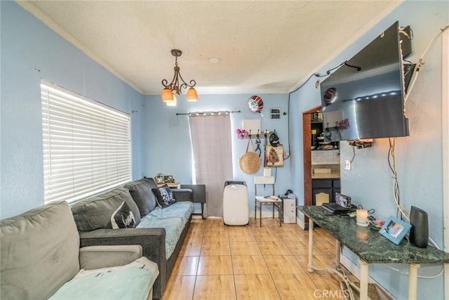 living room featuring crown molding and a notable chandelier