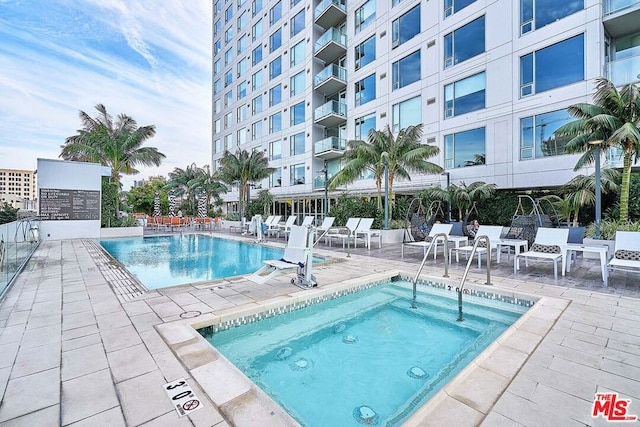 view of swimming pool with a patio