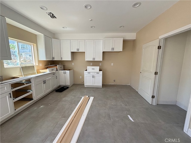 kitchen featuring white cabinets