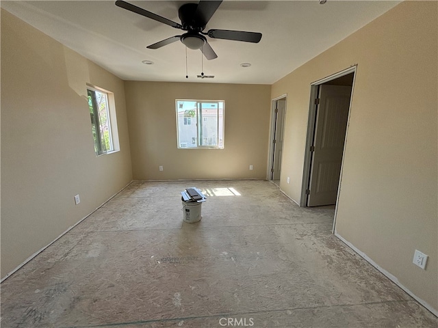 spare room with ceiling fan