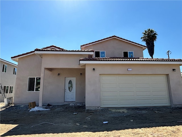 view of front of property with a garage